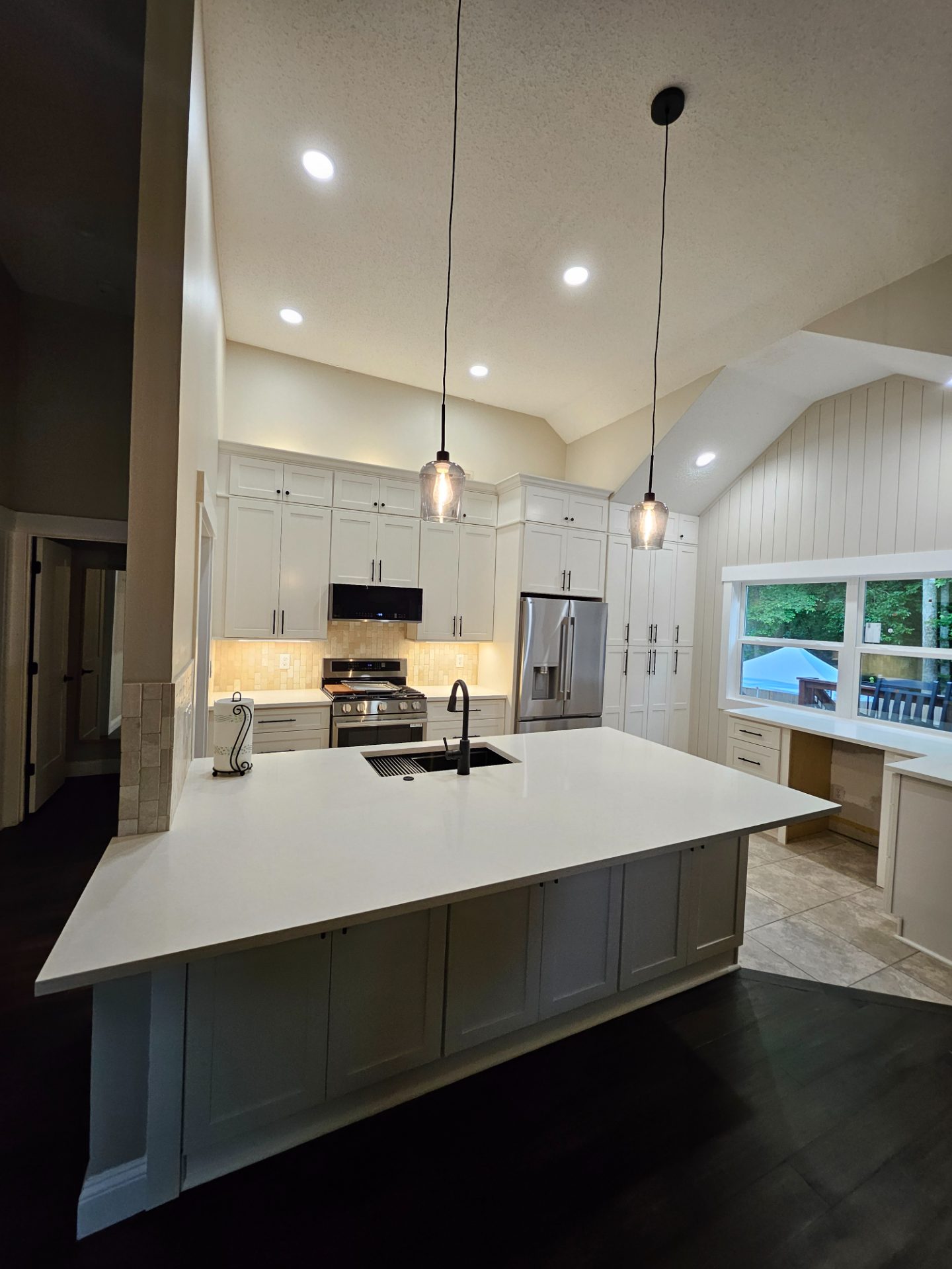 Vaulted kitchen with a long island and pendant lights in Doraville