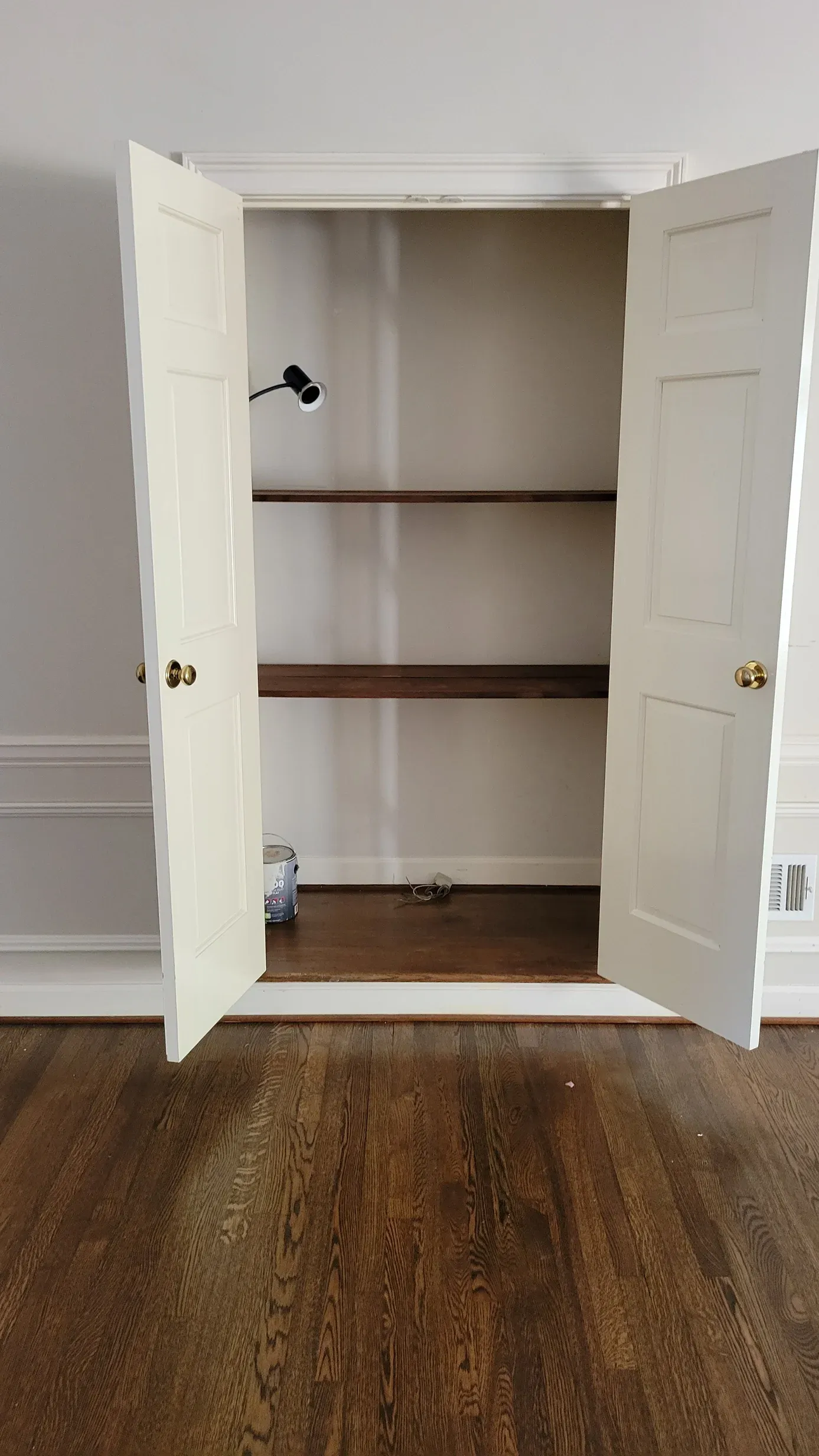 White painted linen shelving inside a closet