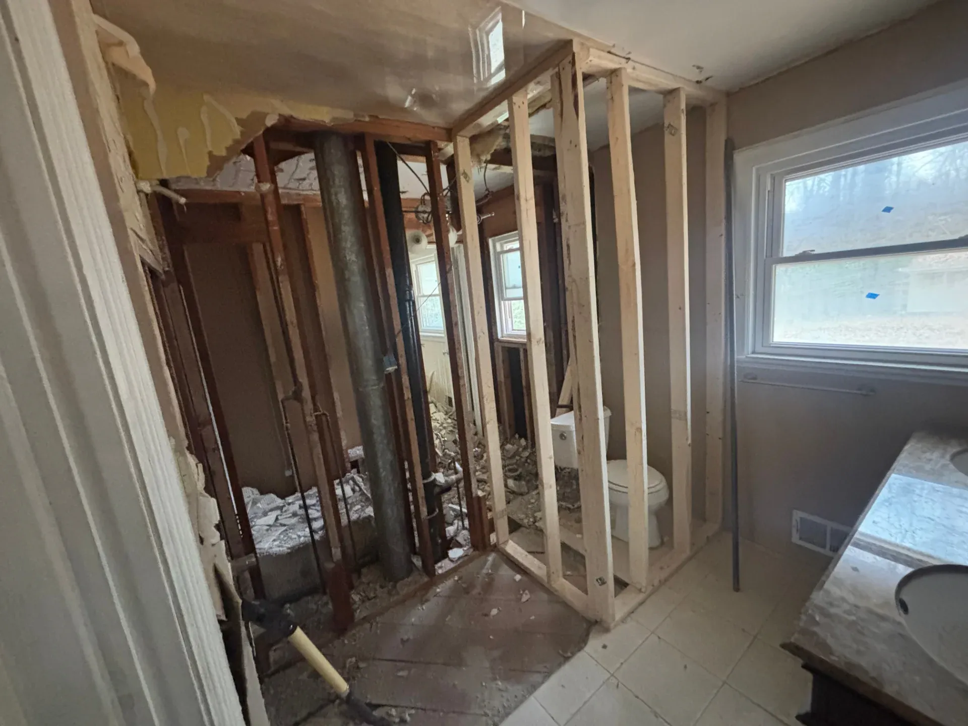 Open finished basement room with recessed lighting