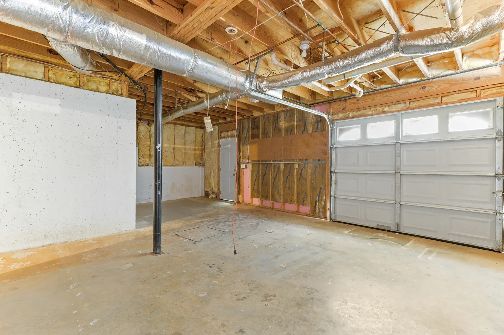 Basement opened to the joists and ductwork before finishing