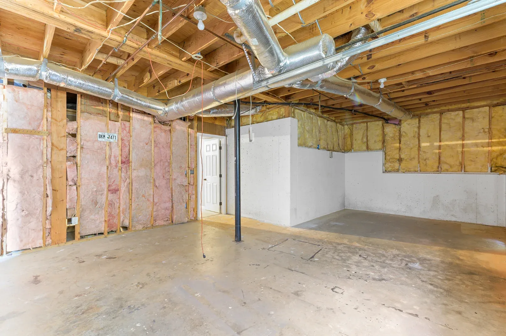 Basement stud walls up with the ceiling still open