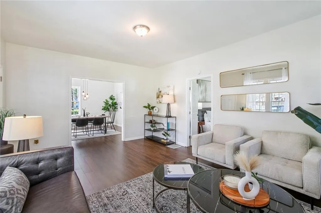 Finished living space with wood flooring and fresh white walls in Doraville