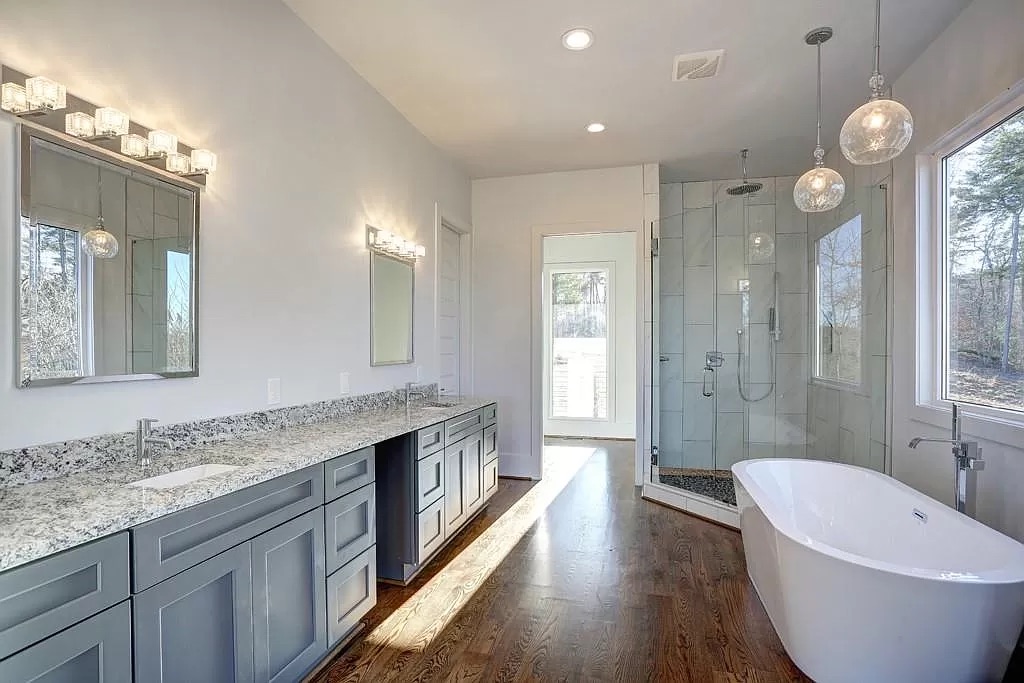 Large custom home with a covered porch and a two-car garage