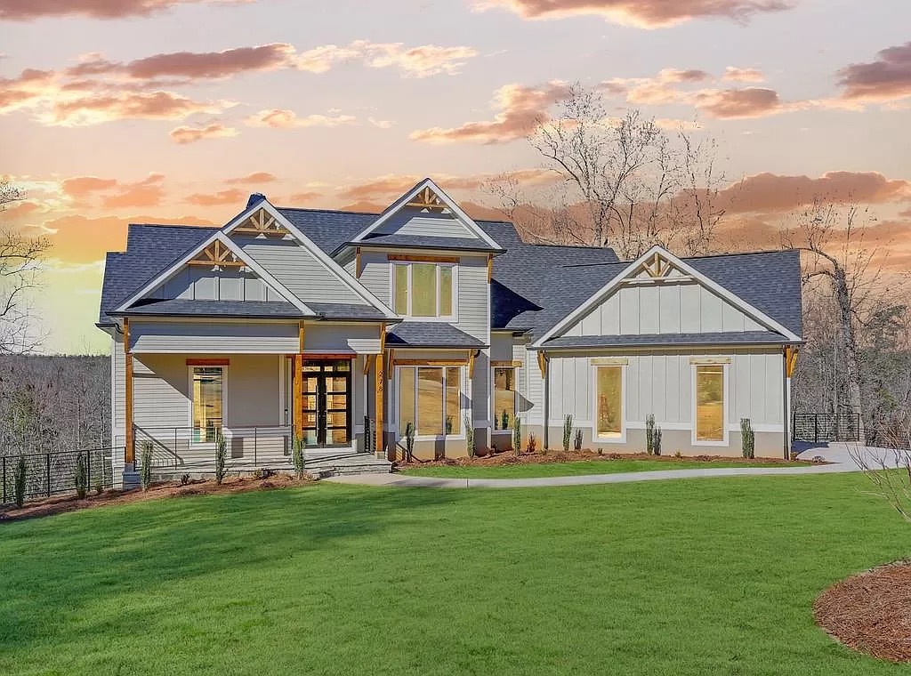 Large custom home with a covered porch and a two-car garage