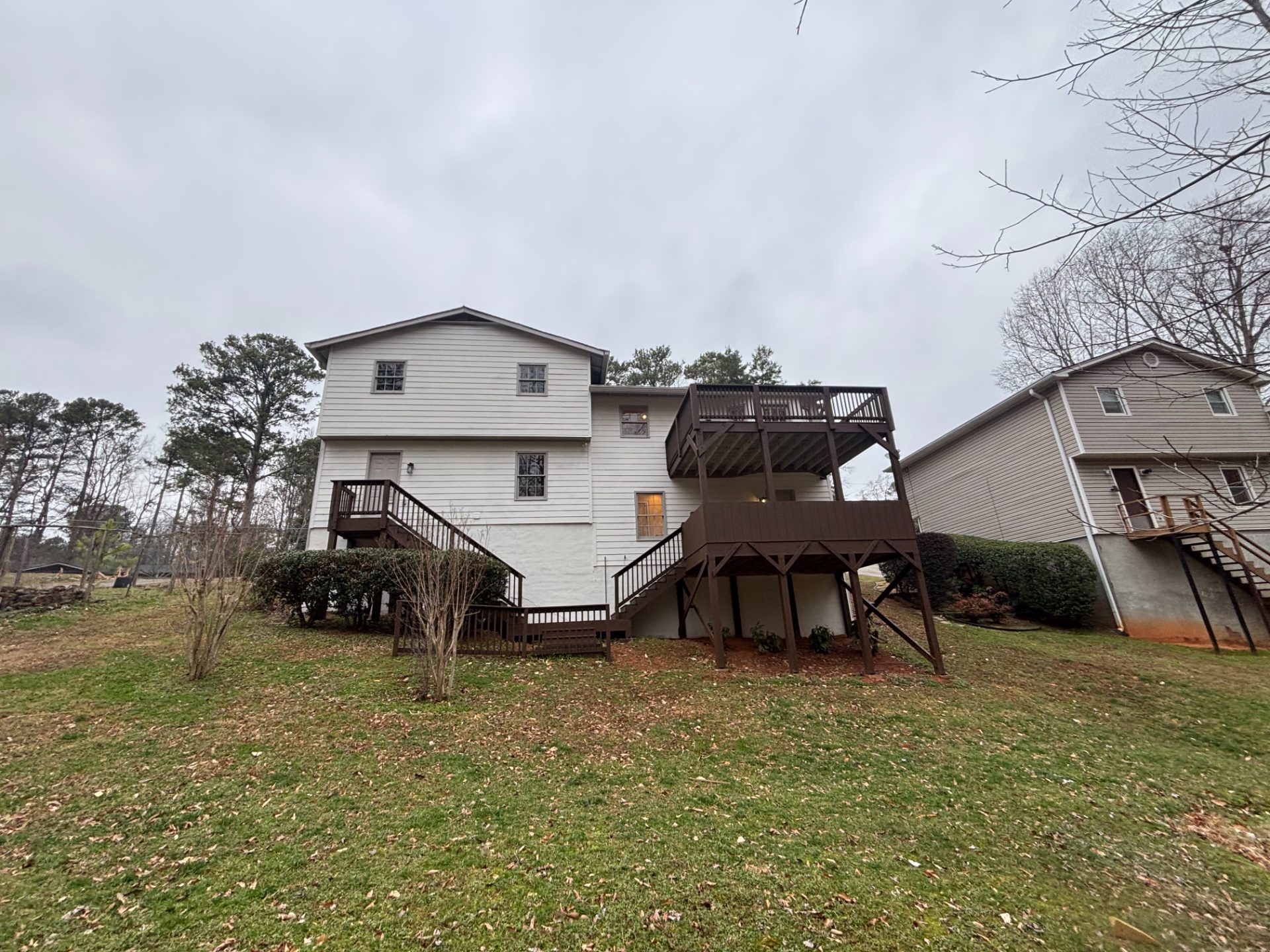 Split-level house on a wooded lot with a rear deck