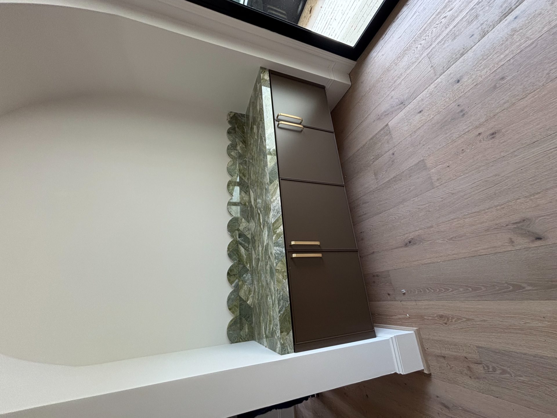 Kitchen with a full slab backsplash, wood cabinets and a pro range in Waleska