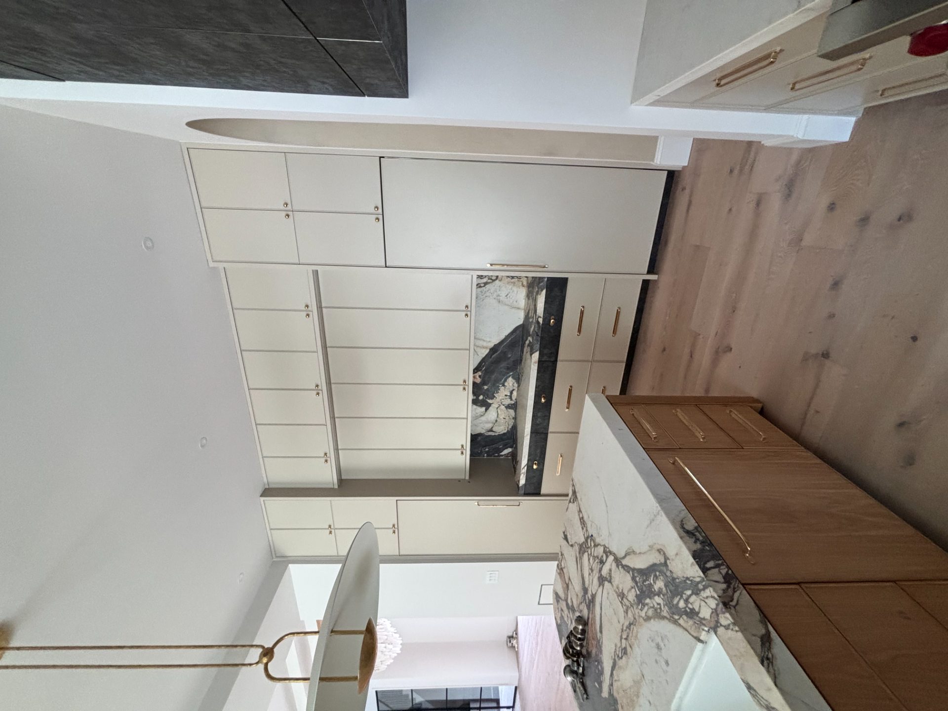 Kitchen with a full slab backsplash, wood cabinets and a pro range in Big Creek