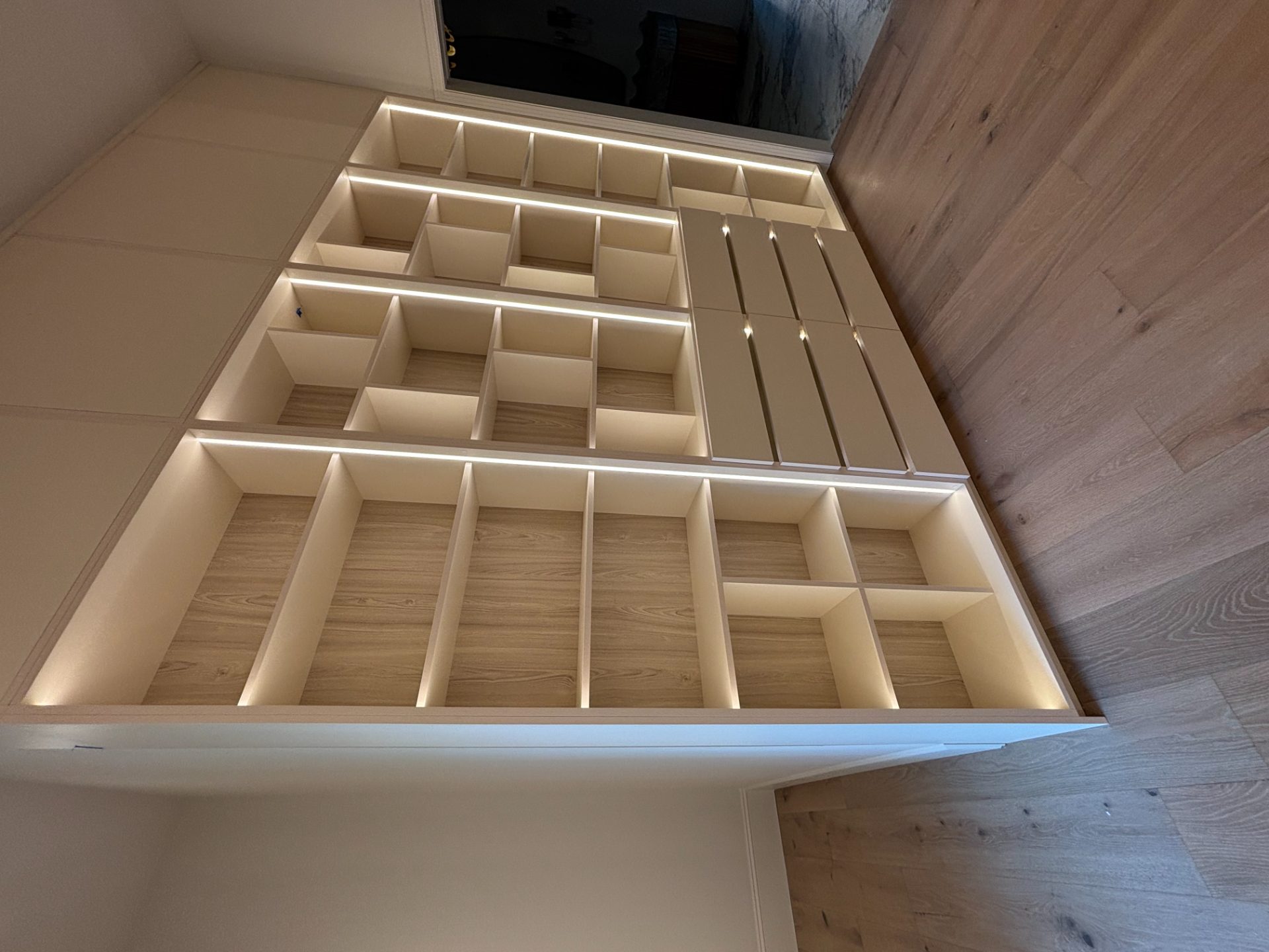 Custom closet built out with shelving, drawers and hanging rods