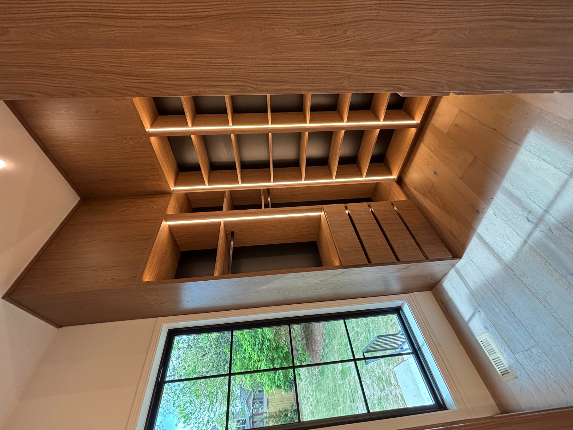 Closet system with open shelving and a window