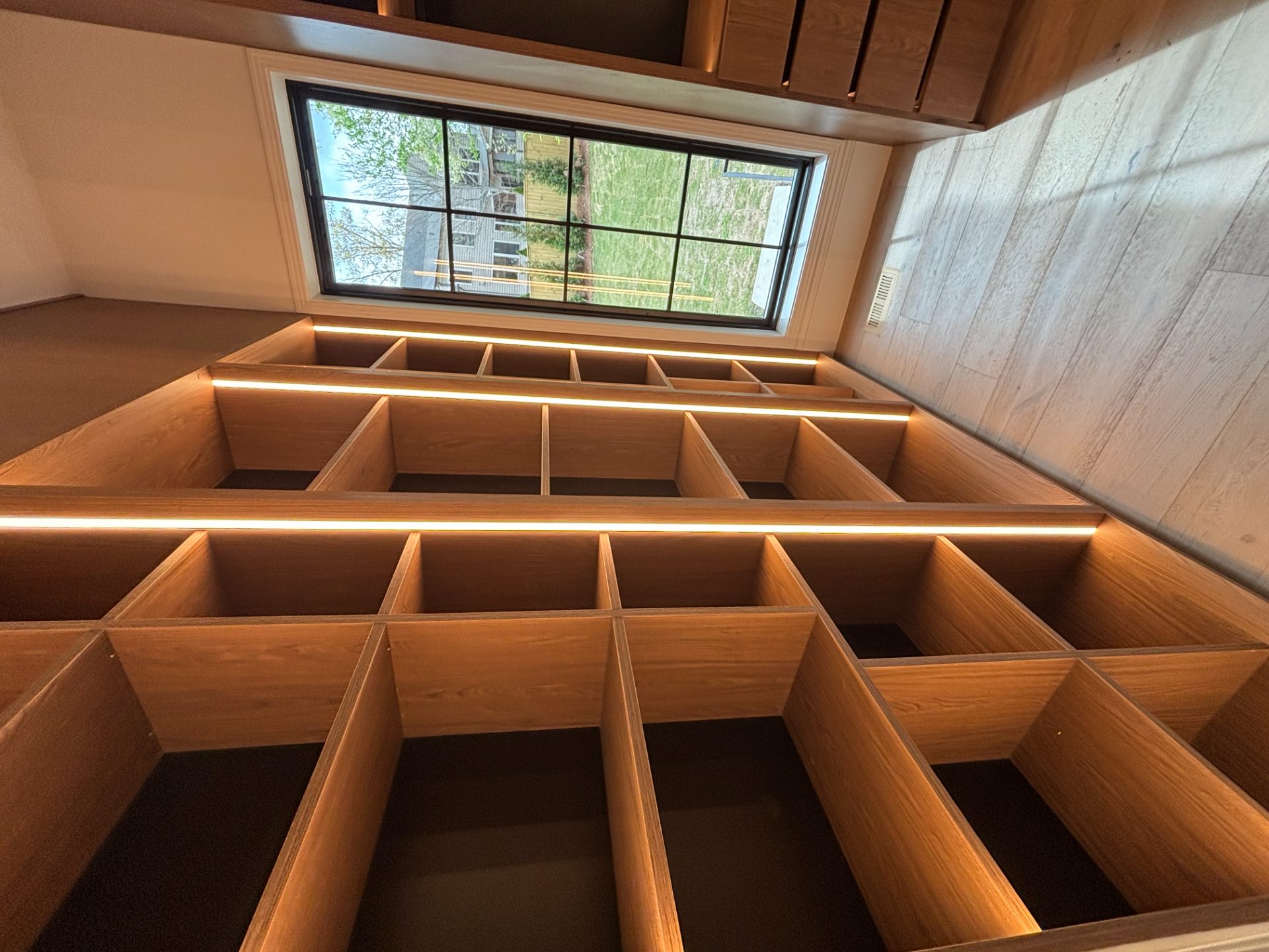 Closet system with open shelving and a window