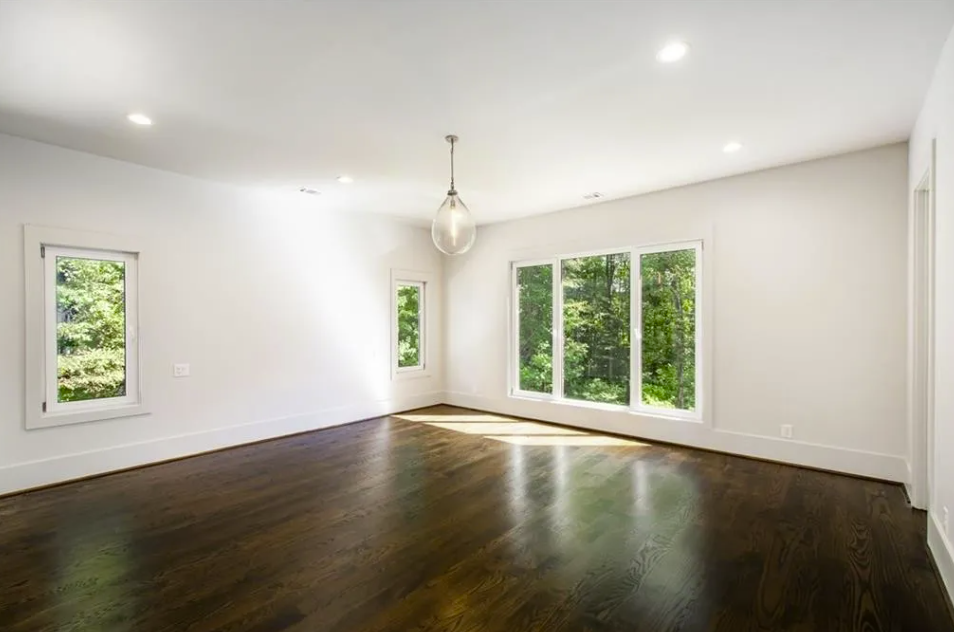 New bedroom with hardwood flooring and tall windows in Waleska